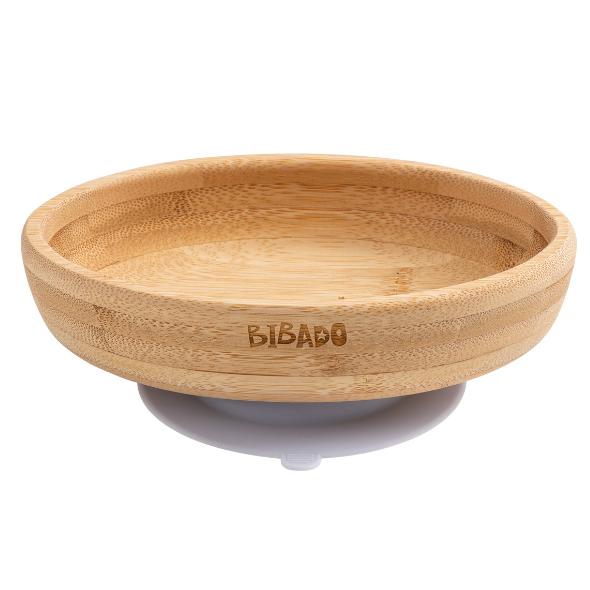 Natural bamboo suction bowl with curved sides and "BIBADO" engraved, featuring a grey and white suction base. - Product image