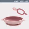 Pink silicone weaning bowl with suction base and matching Dippit spoon.