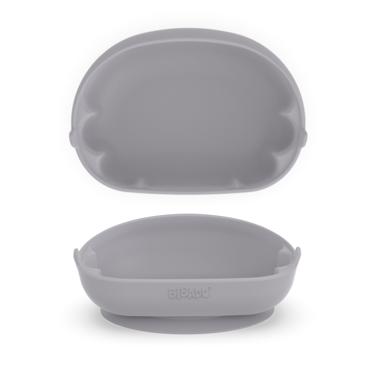 A blue-grey silicone baby feeding bowl shown in two viewpoints, a birds-eye view showing the scalloped edges and a front-facing angle showing the tilted angle with a lower front. - Product image