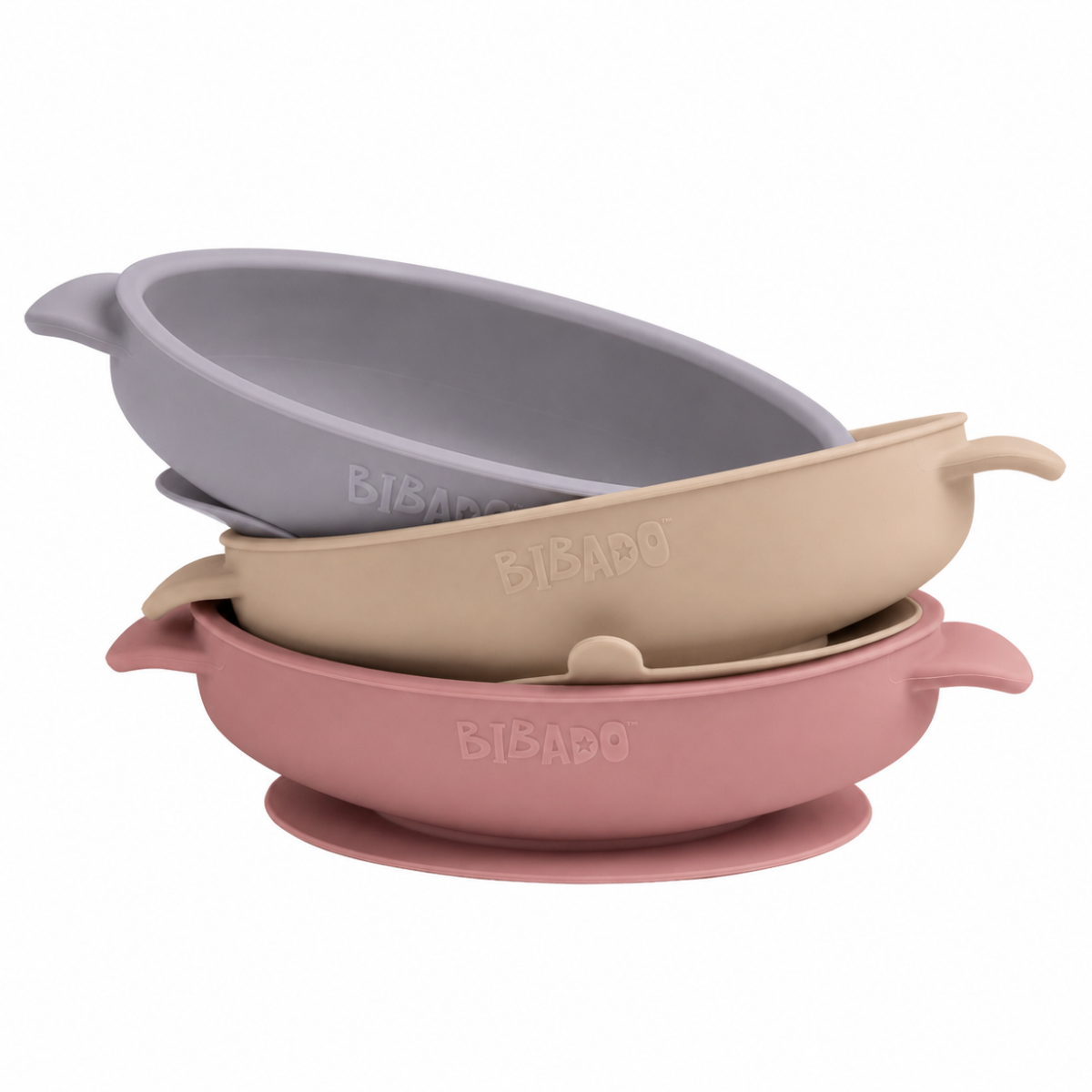 Set of three silicone bowls in gray, beige, and pink on a white background - Product image
