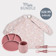 Pink silicone baby feeding set: divided plate, cup, fork, spoon, and long-sleeved bib with bunny print.