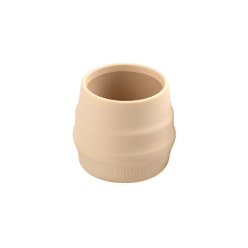 Bibado Sippit™ beige silicone open training cup with ribbed sides for easy grip. - Product image